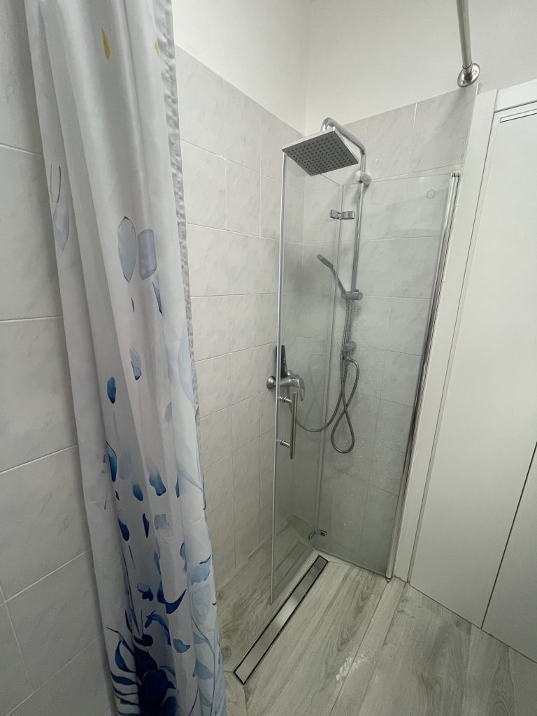 Shower with glass doors renovated in 2025